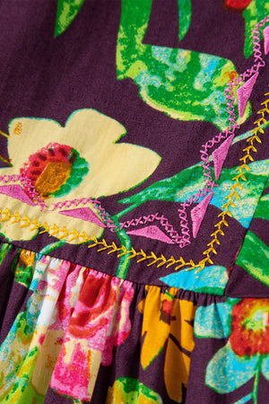 Embroidered floral babydoll blouse with colorful stitching detail
