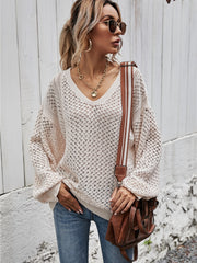 Open-knit sweater in Ivory with balloon sleeves and V-neck, styled with jeans.