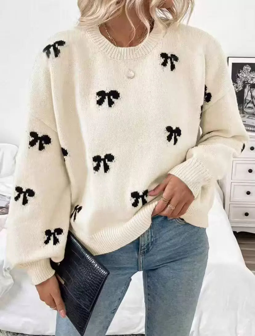 cream pullover sweater with bow-print and crew neck