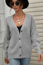 Gray diamond knit button-down cardigan with balloon sleeves and V-neck.