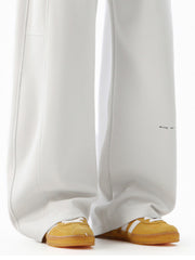 Men's light gray casual drawstring joggers with subtle text detail on the leg.