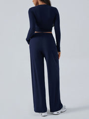 Dark blue ribbed knit crop top and wide leg pants set from behind.
