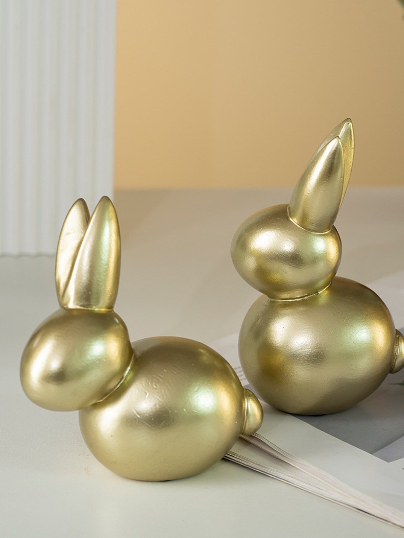 Elegant gold resin rabbit figurines, Style A and Style B, abstract contemporary decor.