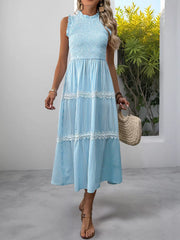 Blue striped sleeveless midi dress with smocked bodice and lace trim tiers.
