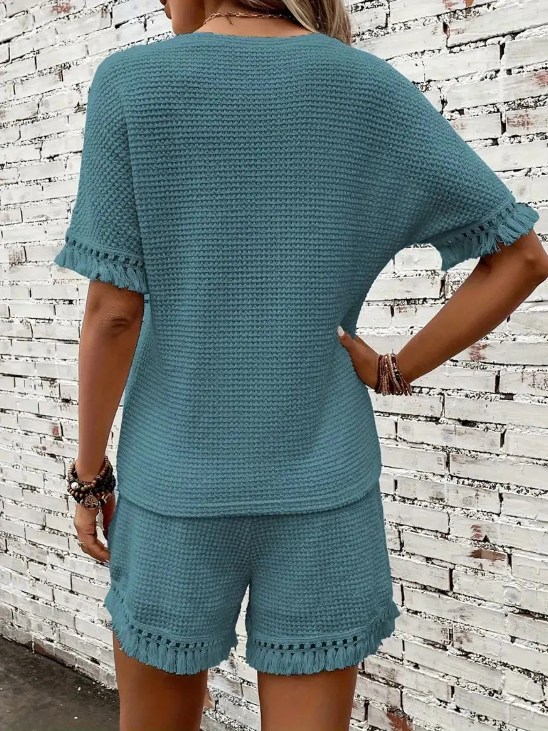 Textured knit set in Air Force Blue with fringe trim on short sleeves and hem.