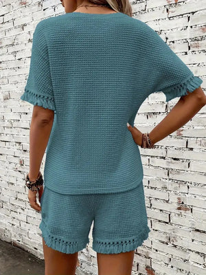 Textured knit set in Air Force Blue with fringe trim on short sleeves and hem.