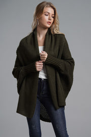 Olive drape-front batwing knit cardigan with wide sleeves and ribbed cuffs.