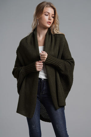 Olive drape-front batwing knit cardigan with wide sleeves and ribbed cuffs.