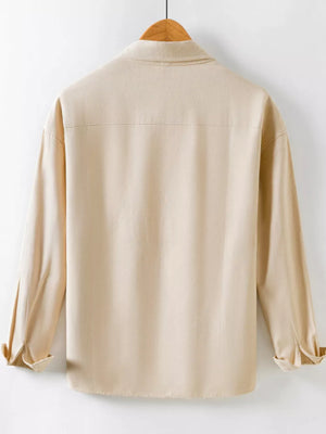 Khaki long sleeve button-up shirt with a classic collar and rolled cuffs.