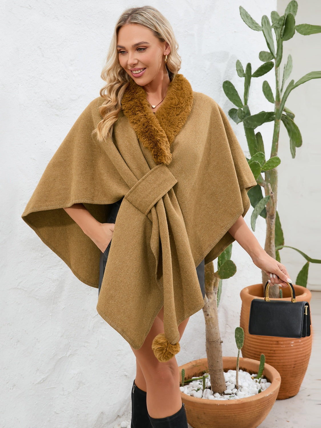 Camel faux fur collar wrap poncho with tie closure and pom-pom detail.