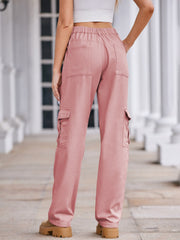 Dusty pink wide-leg cargo pants with utility pockets and elastic waistband.