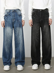 Wide-leg distressed denim jeans in vintage wash dark and medium colors with frayed details.