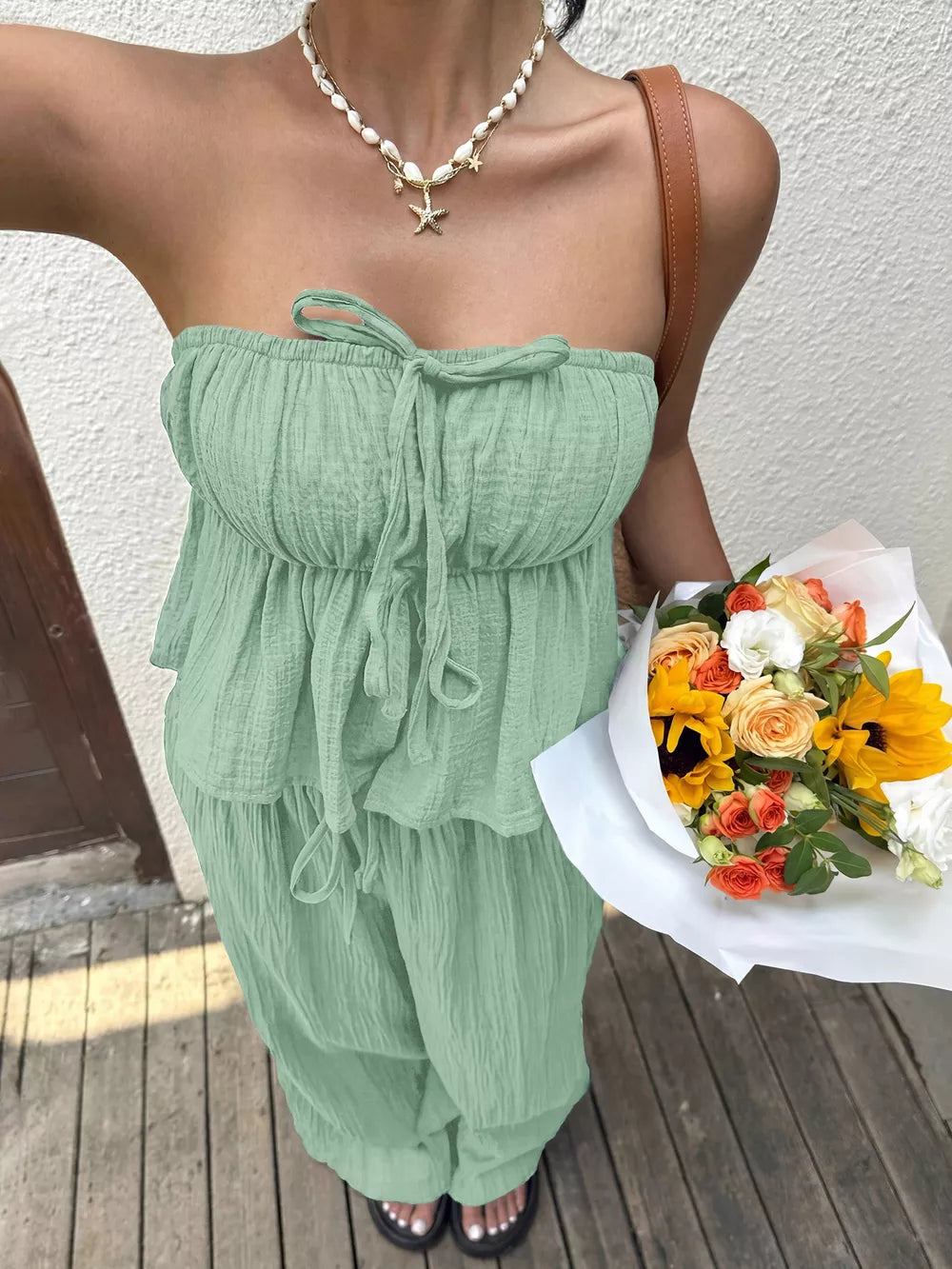 Gum Leaf tube top and wide-leg pants set with tiered ruffles and tie front detail.