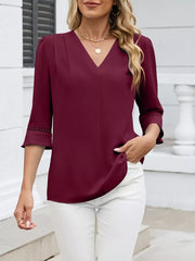 Wine red V-neck blouse with 3/4 sleeves featuring lace trim detail.