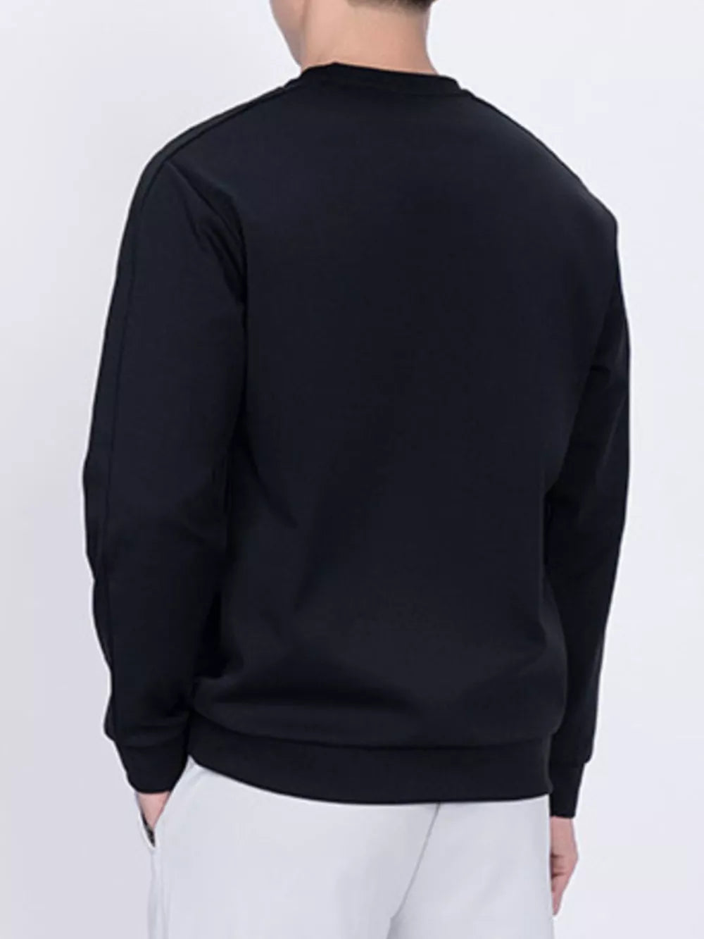 Black zippered sweatshirt with crew neck and long sleeves.