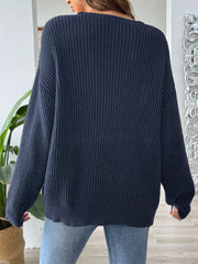 Dark navy ribbed knit sweater with off-shoulder neckline and contrast trim detail.