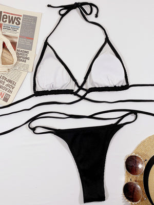 Black ribbed halter bikini set with crisscross detail and tie sides.
