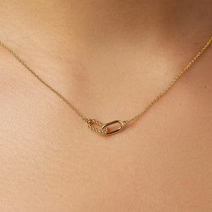 Gold interlocked link necklace with a twisted and oval link detail.