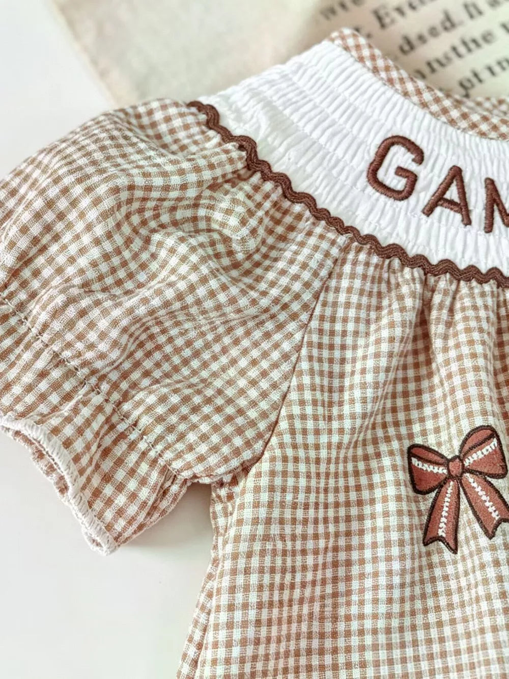 Children's Gingham Football Puff Sleeve Dress in Brown, close-up detail