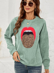 Light green corduroy crewneck sweatshirt with a red lip and leopard tongue print.