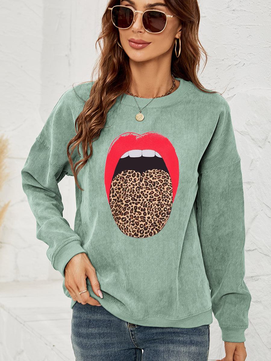 Light green corduroy crewneck sweatshirt with a red lip and leopard tongue print.