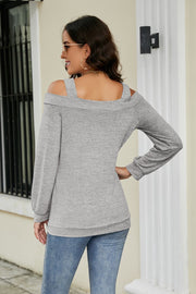 Gray long sleeve sweater with cold shoulder cutouts and square neckline.