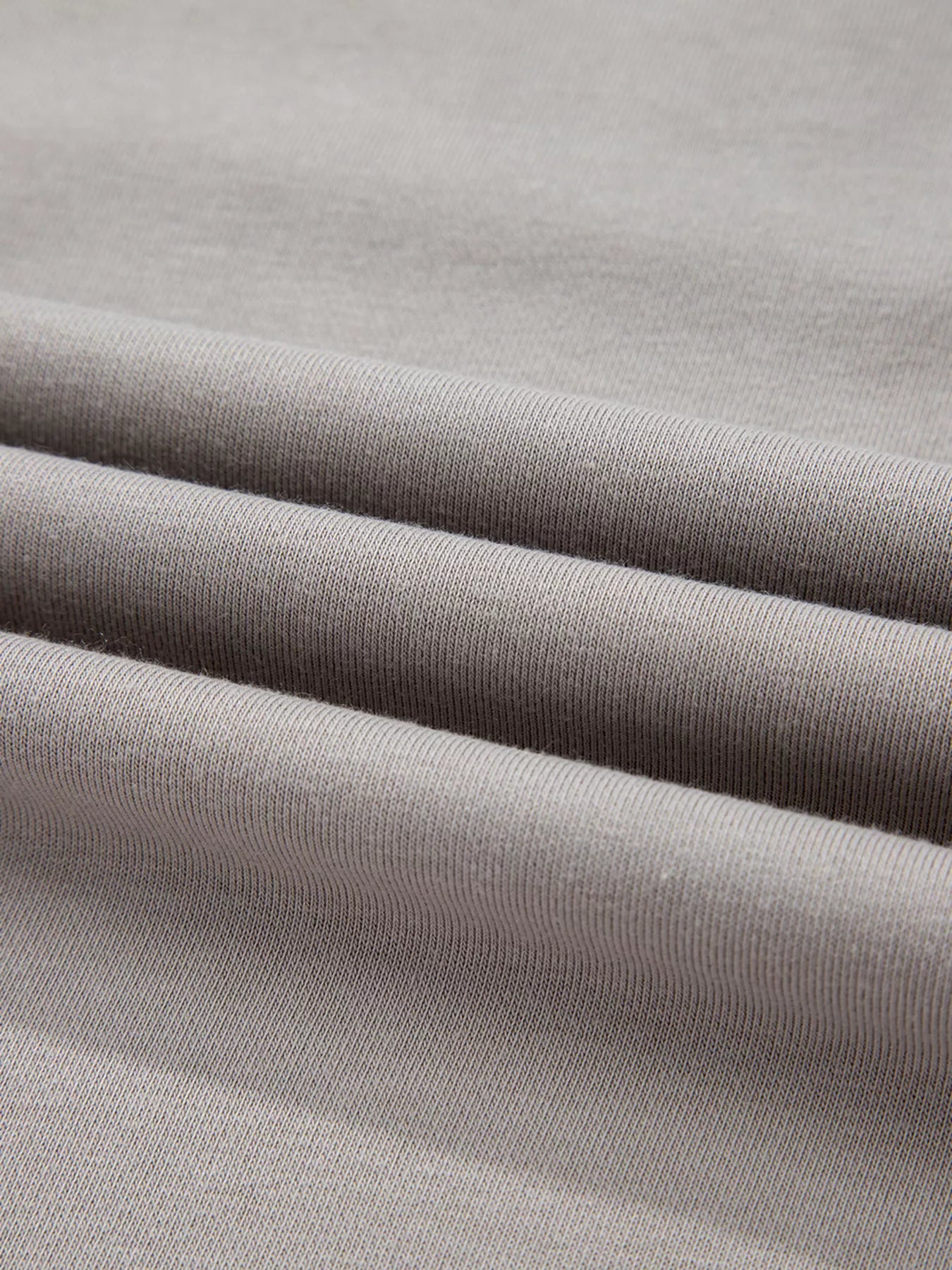 Gray V-neck sweatshirt with a textured knit fabric detail.
