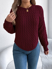 Burgundy cable knit sweater with asymmetric hem and crew neck.