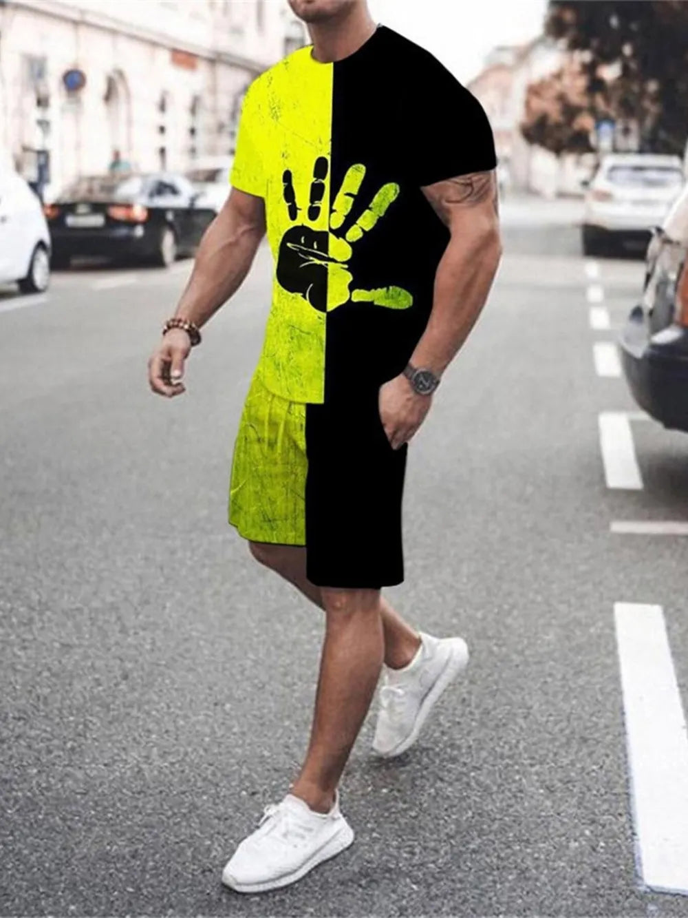 Men's black and yellow graphic tee and shorts set with hand print detail.