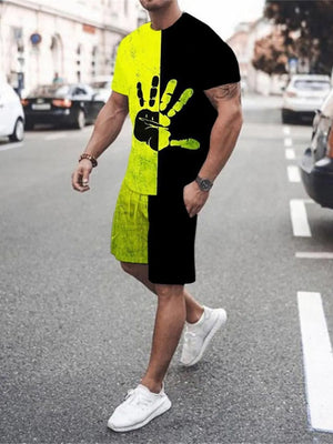 Men's black and yellow graphic tee and shorts set with hand print detail.
