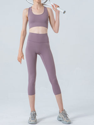 Lavender cropped leggings with a high waistband and subtle mesh detail at the ankle.