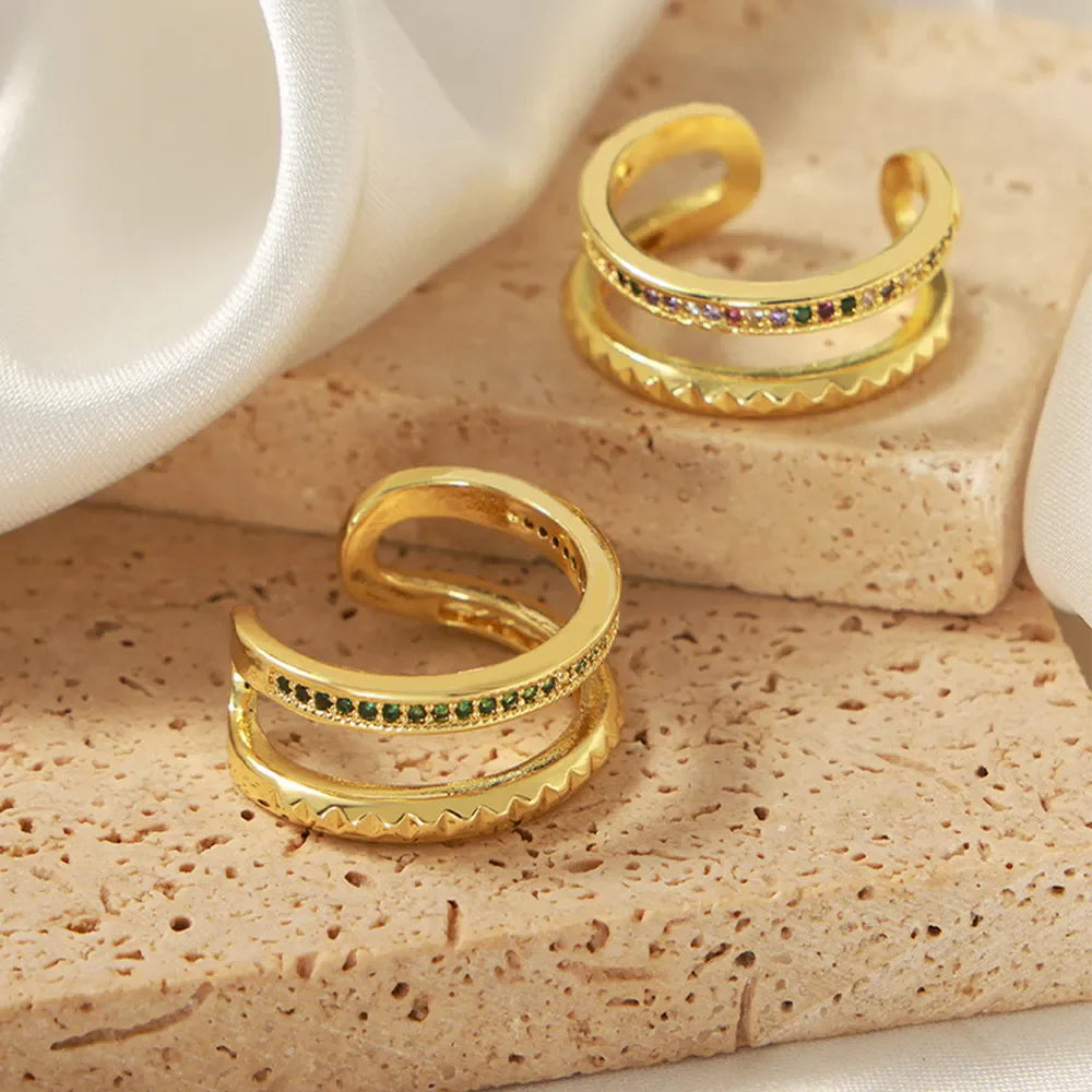 Double band rings with pavé dark green and multicolor stones, gold tone copper.