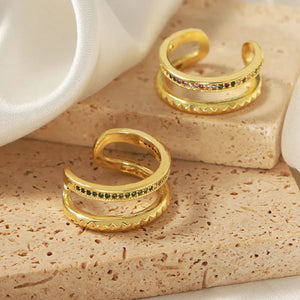 Double band rings with pavé dark green and multicolor stones, gold tone copper.