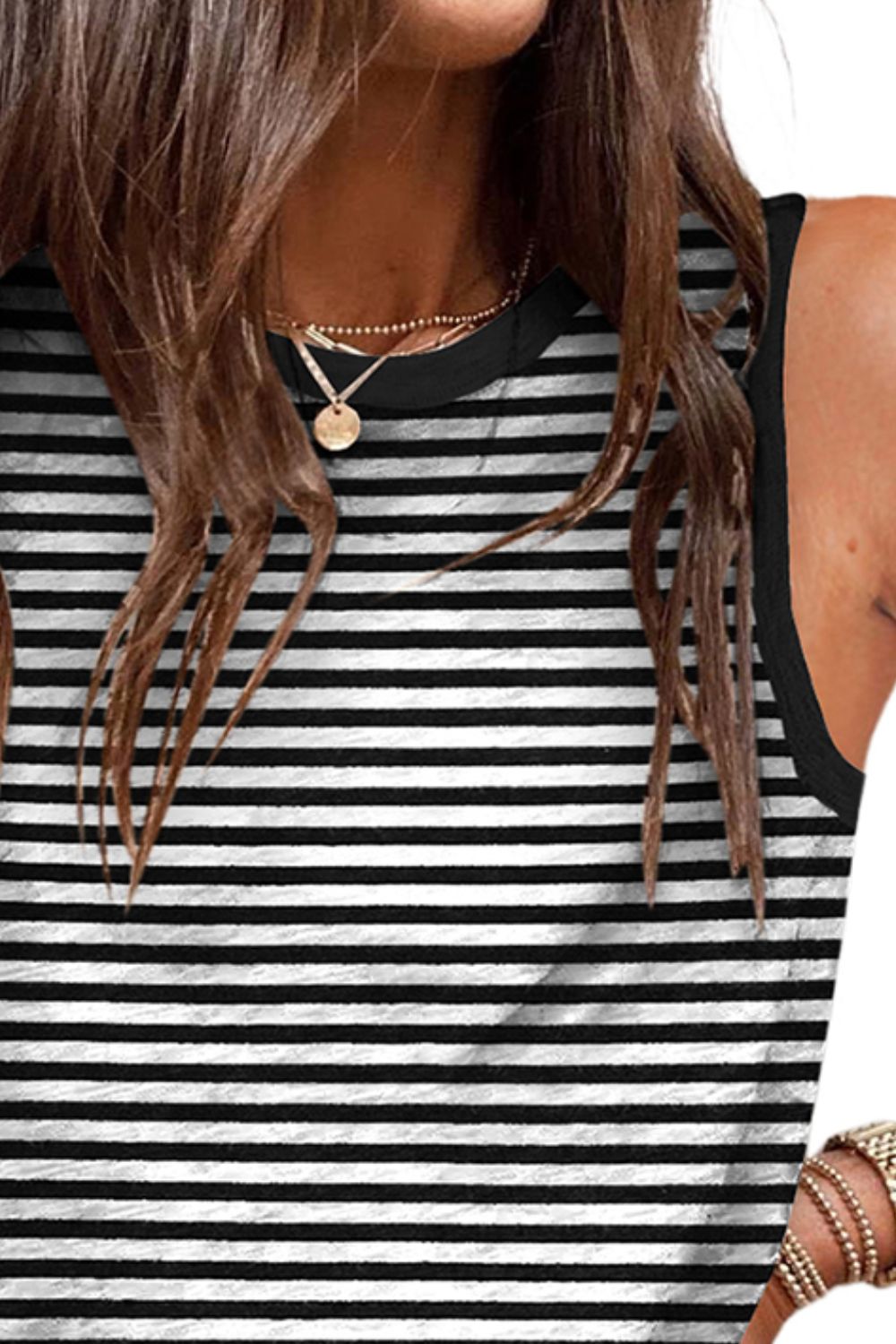 Black and white striped tank top with contrast trim and crew neck.