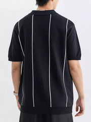 Black knit polo shirt with white vertical stripes and ribbed hem.