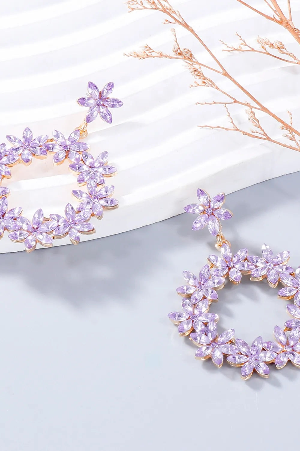 Floral halo drop earrings in pink purple, featuring crystal flowers on alloy.