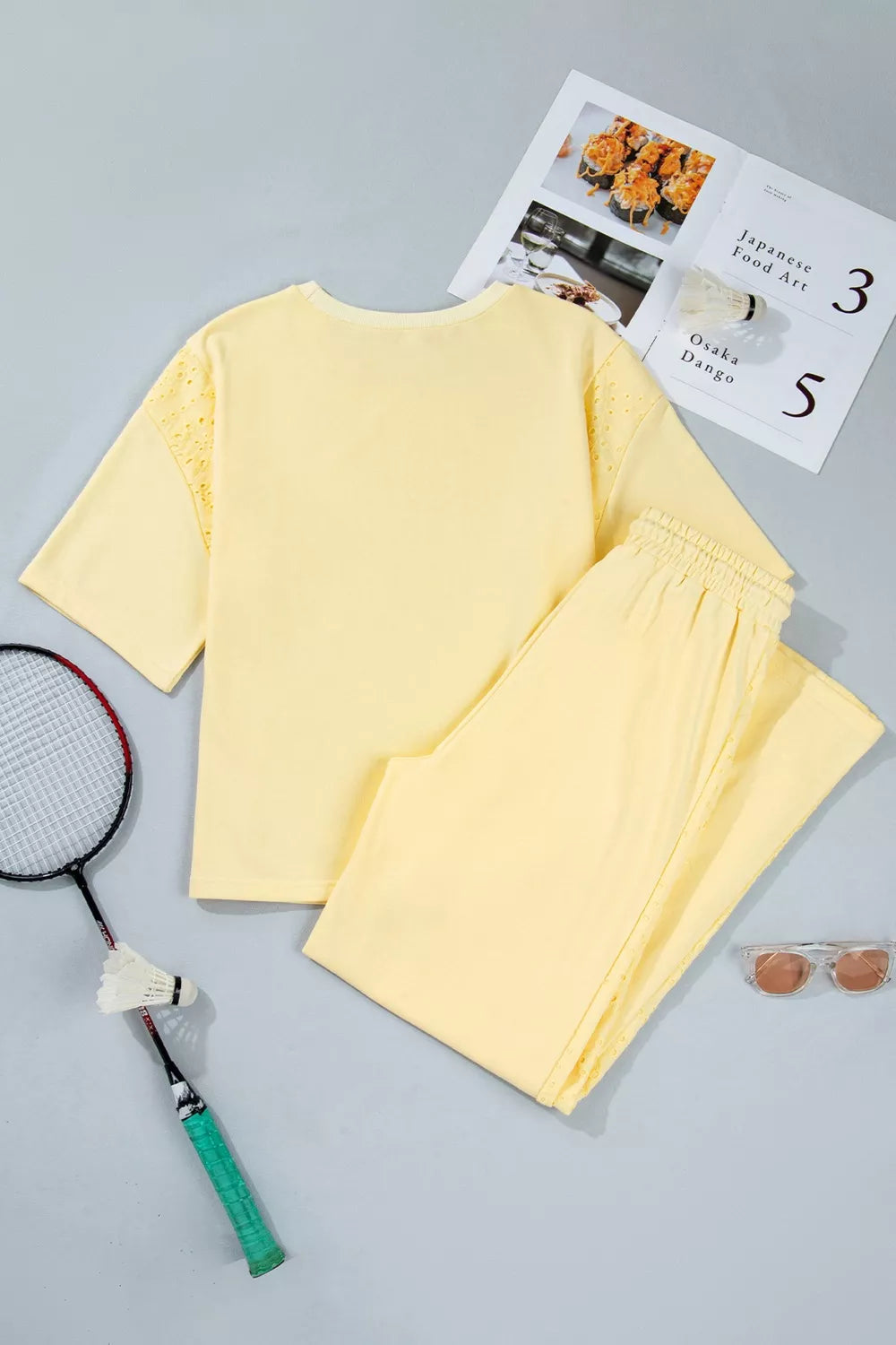 Yellow cotton embroidered half-sleeve top and drawstring pants set.