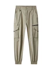 Khaki cargo pants with multiple pockets and elastic cuffs.