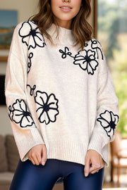 Cream embroidered floral mock neck knit sweater with long sleeves.