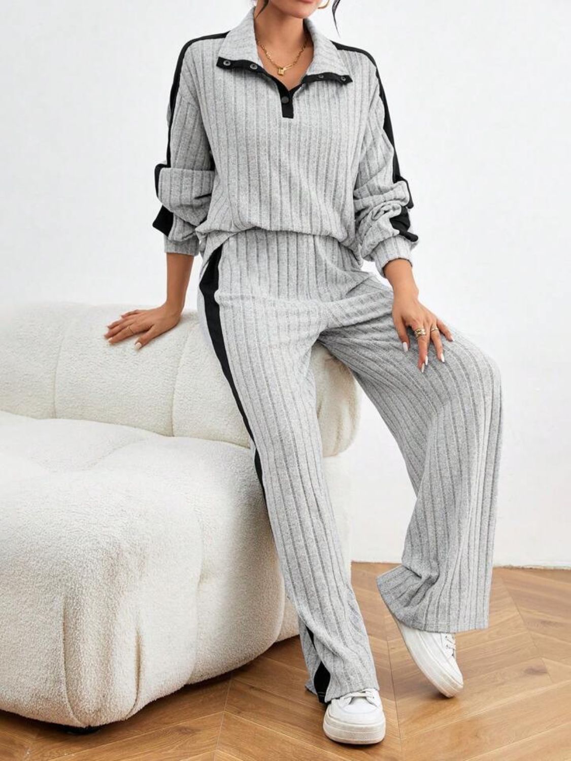 Light gray ribbed lounge set with contrast black trim, polo collar and button detail.