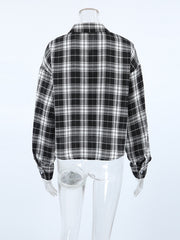 Oversized black and white plaid cotton button-up shirt with collar and cuffs.