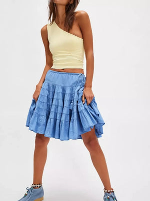 Tiered drawstring mini skirt in Sky Blue with tassel detail and ruffled tiers.