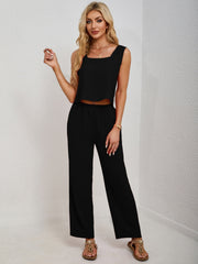 Black cropped tank top and palazzo pants set with square neckline.