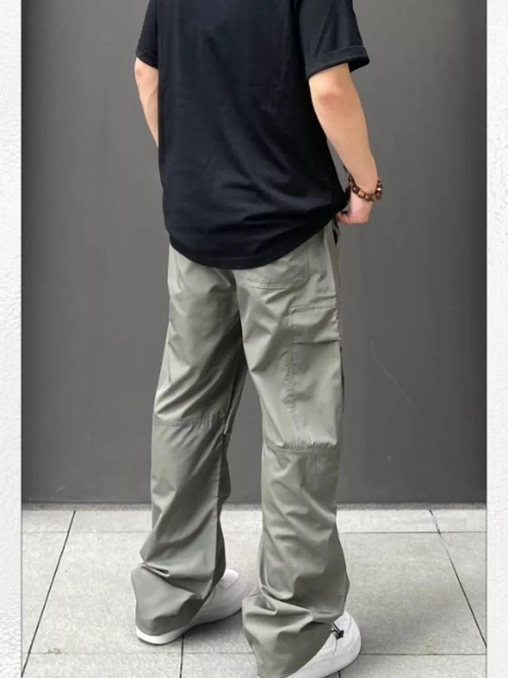 Men's Gray Green relaxed fit cargo sweatpants with ankle drawstring and multiple pockets.