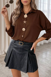 button-up shirt in dark brown featuring buttoned and relaxed fit