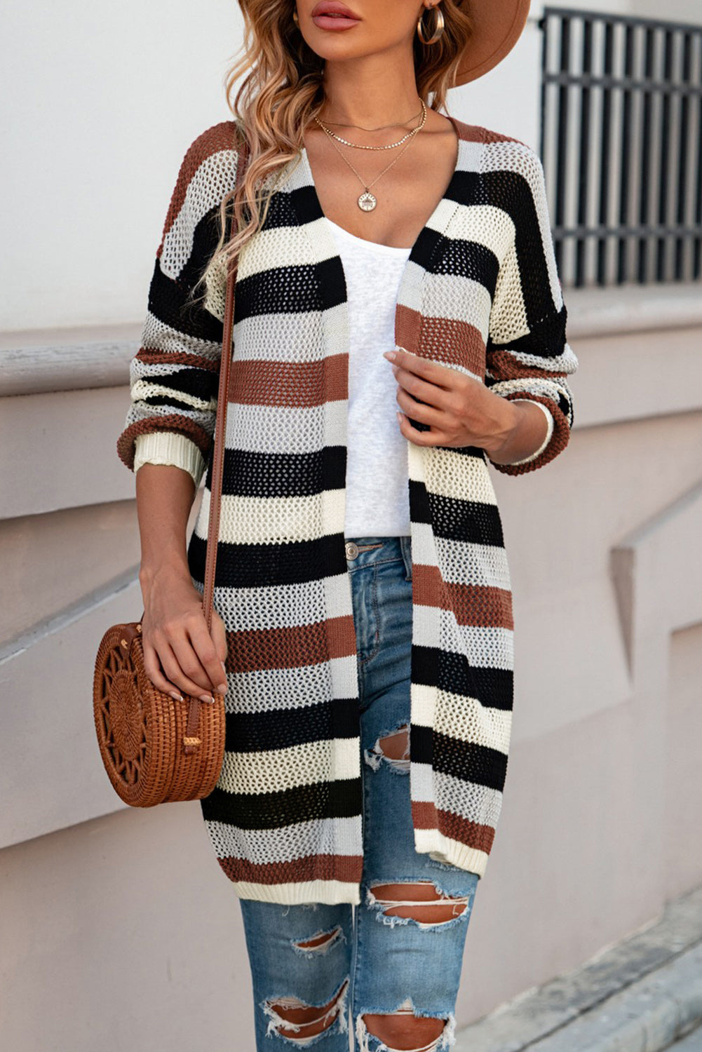 Horizontal stripe open knit duster cardigan in black, brown, and cream acrylic.