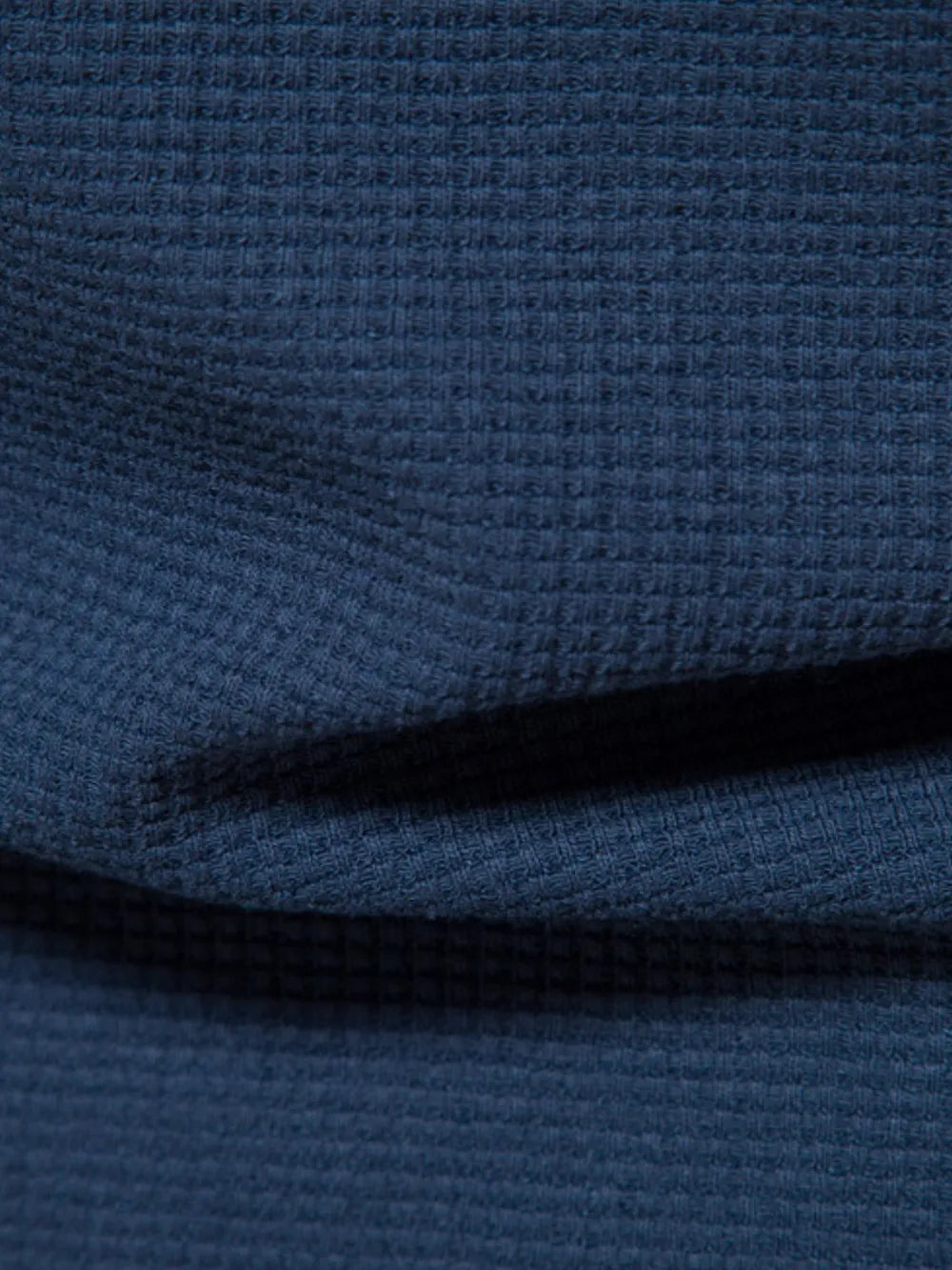 Navy textured crew-neck t-shirt knit with a waffle weave pattern.