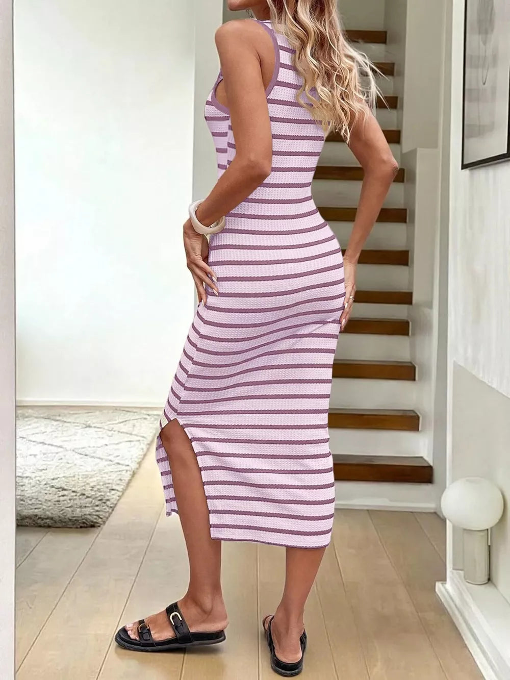 Purple striped bodycon midi dress with side slit and ribbed texture.