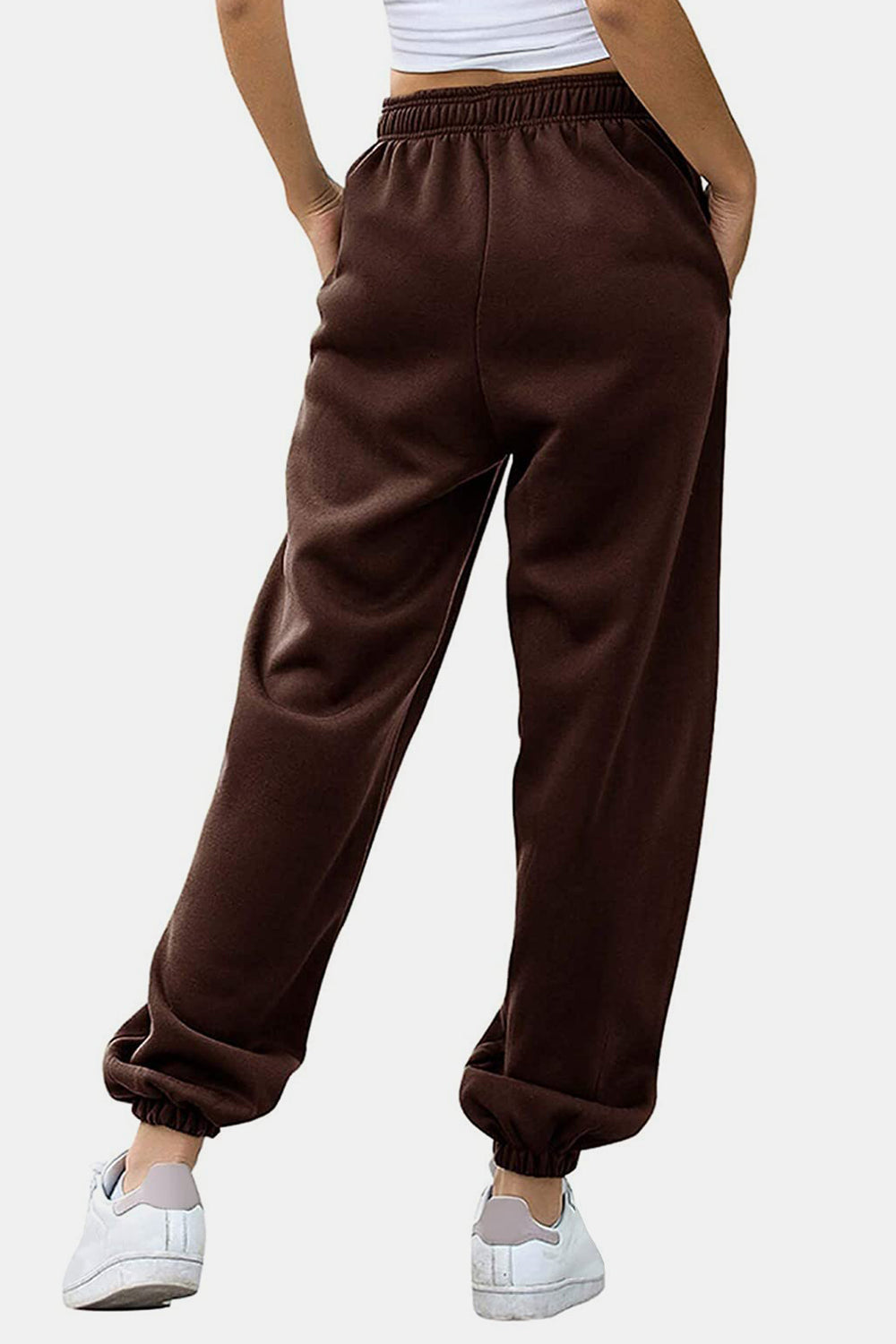 Relaxed-fit cuffed sweatpants in chocolate brown with elastic waistband and cuffs.