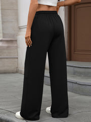 Black high-waist drawstring wide-leg pants with a comfortable fit.